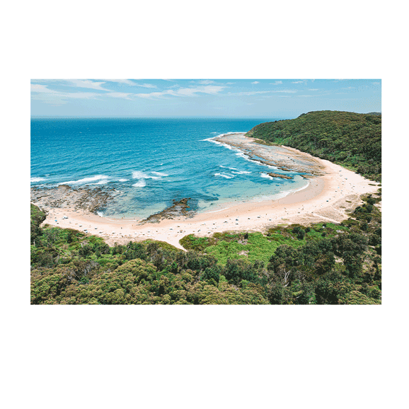 A stunning aerial view of Bateau Bay, NSW, showcasing golden sand, turquoise ocean waves, and people enjoying a sunny beach day. The lush green headland contrasts with the vibrant blue waters, creating a perfect coastal scene.