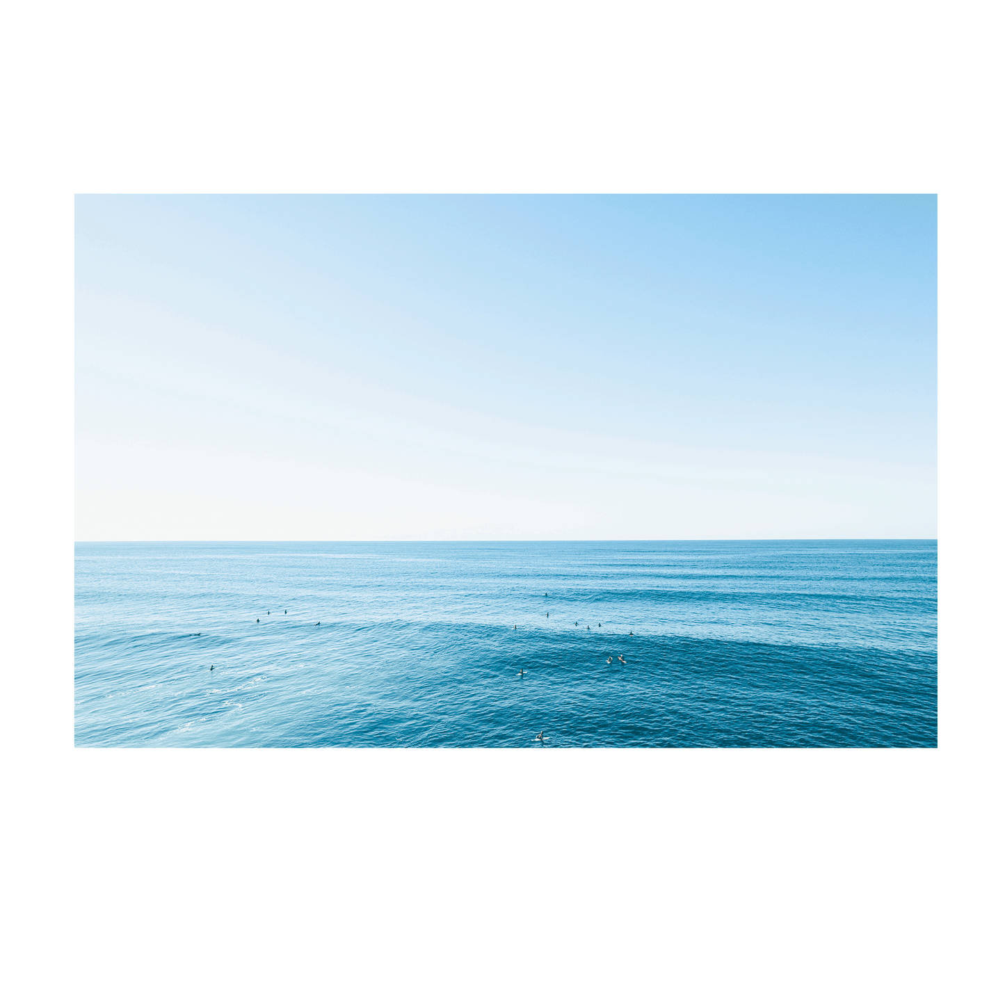 A breathtaking coastal aerial print of Forresters Beach, NSW, showcasing rolling waves, surfers, and the deep blue hues of the ocean.