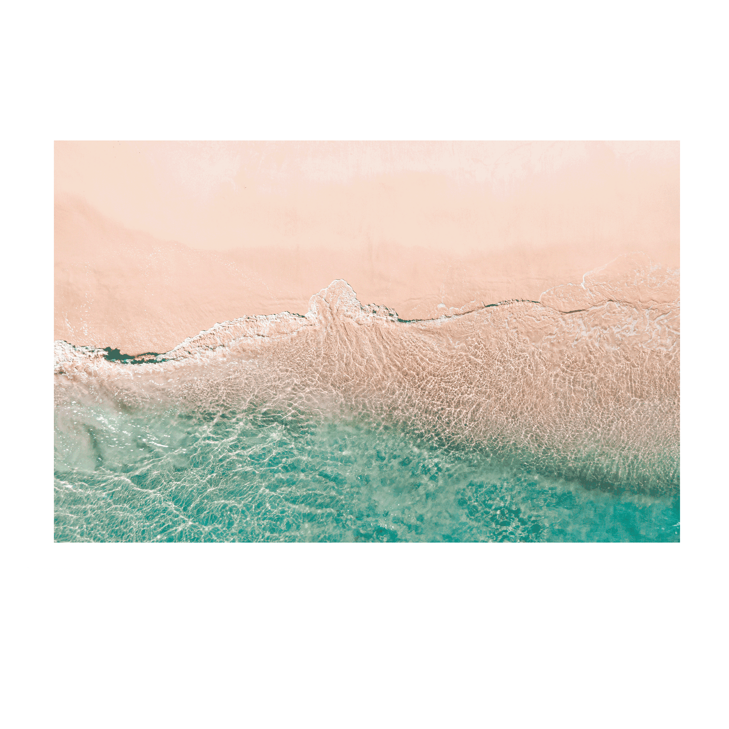 A soft aerial coastal scene at Norah Head, NSW, showcasing the gentle transition between sandy beach and clear aqua ocean waters.