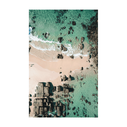 A breathtaking aerial view of Soldiers Beach, Norah Head, NSW, showcasing geometric rock formations, soft sand, and crystal-clear turquoise waters.

