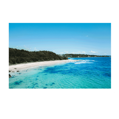 A breathtaking aerial view of Norah Head, NSW, showcasing turquoise waters, golden sand, and lush greenery.